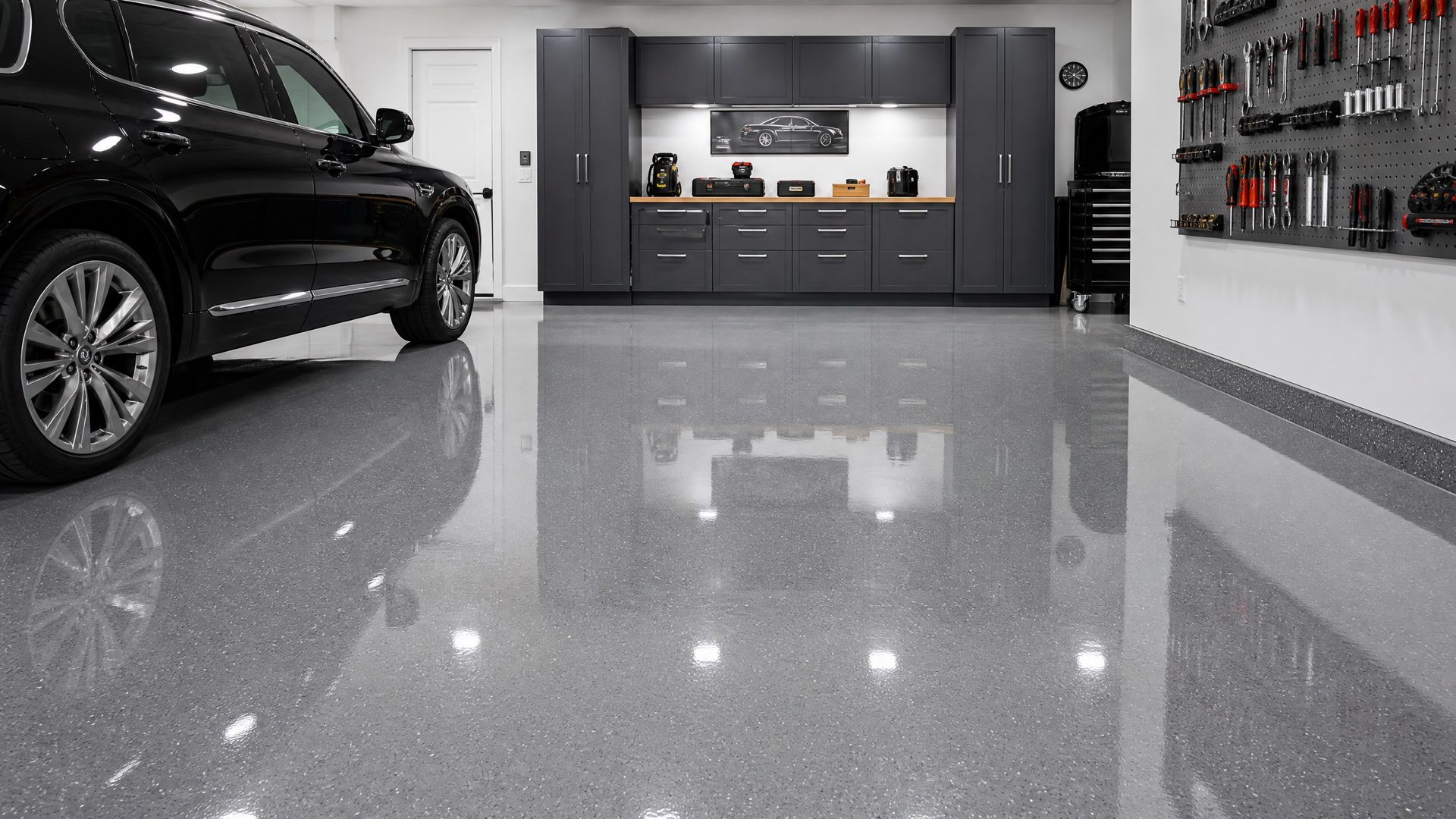 High-gloss gray epoxy garage floor coating with flake finish